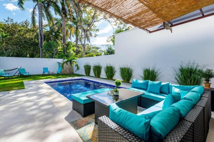 Ultramodern Townhome with an Inviting Coastal Design and Lush Outdoor Oasis with a Private Pool