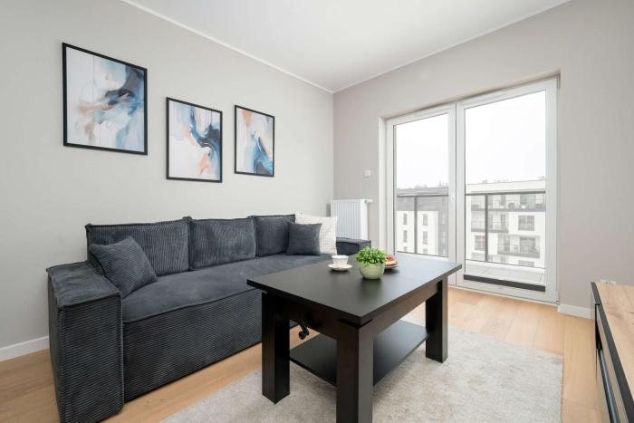 Spacious Apartment with Parking & Balcony by Noclegi Renters