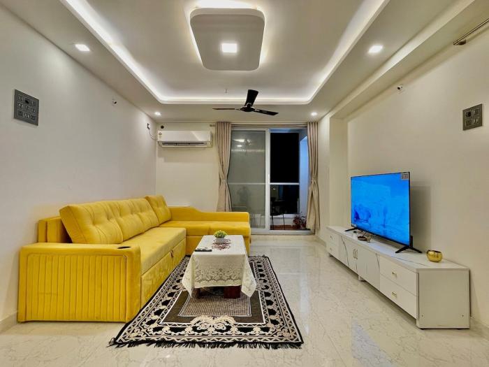 Chic 2 BHK with Balcony & Bold Yellow Lounge Powai