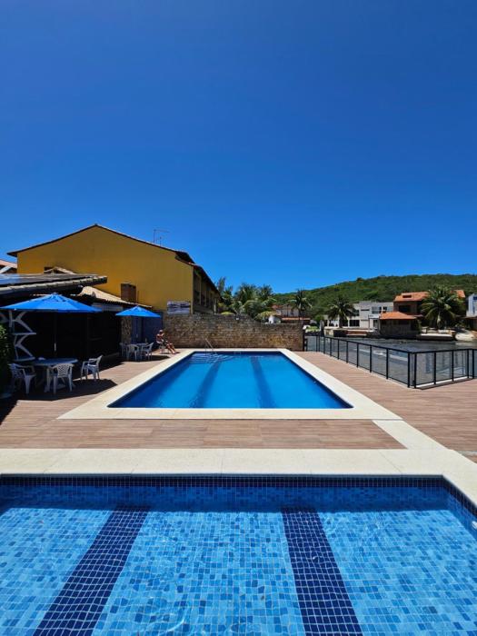 2 quartos com ar condicionado, piscina, sauna e churrasqueira