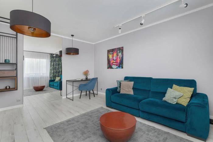 White and Blue Apartment in Szczecin with City View and Desk by Noclegi Renters