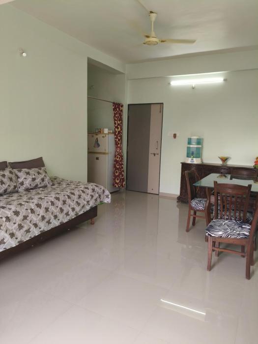 1 big furnished studio apartment with a pantry including fridge, utensils, gas stove and a washing machine with attached bathroom that can accommodate minimum 4 people