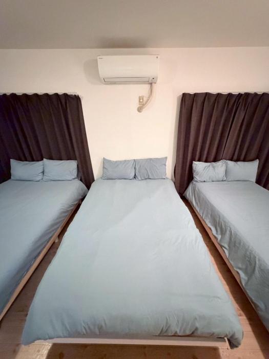 Wide bright room with three beds!