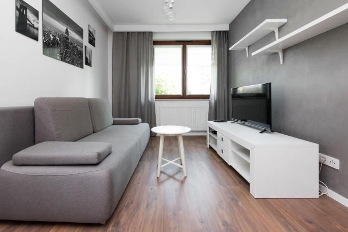 White and Grey Apartment in Cracow with Parking by Noclegi Renters