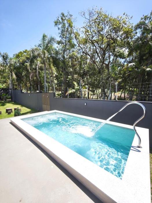 Casa Woods seu Refúgio na Praia do Estaleiro