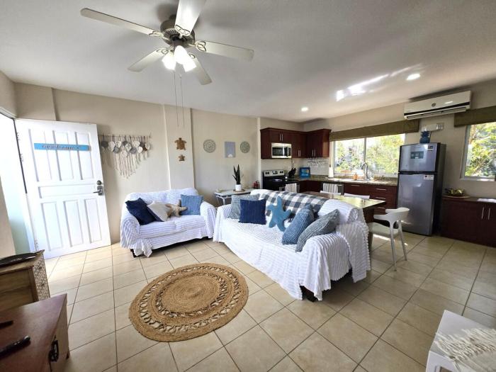 Sunny 2BR Condo with Pool Steps to Town & Beach