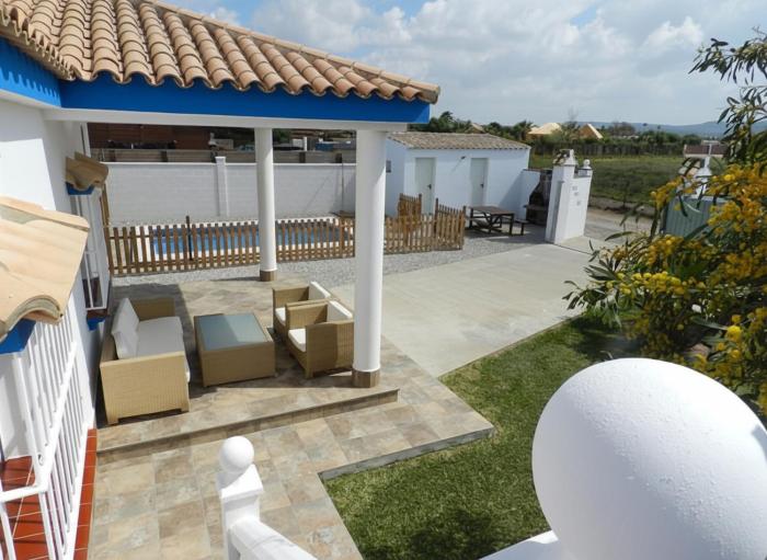 Chalet en la playa con piscina Privada en el Palmar terraza y chimenea