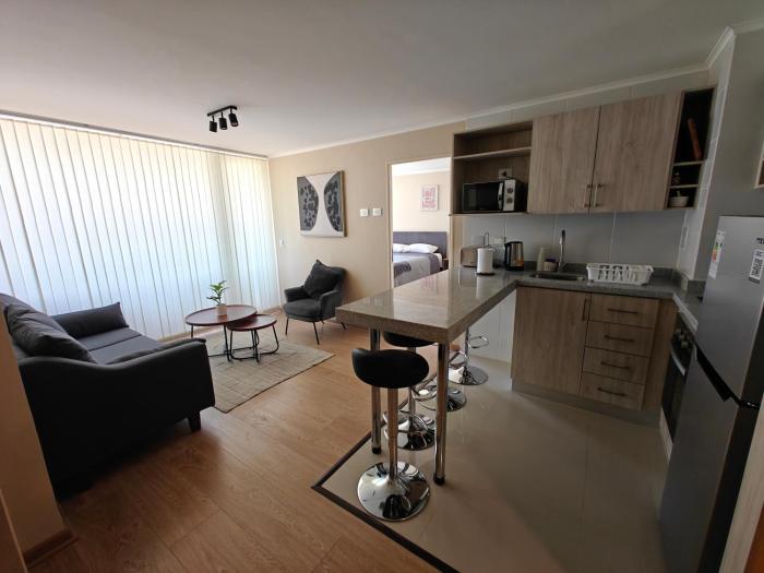 Amplio departamento en pleno centro de Chillán con estacionamiento privado