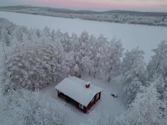Log cabin on the banks of Ounasjoki River