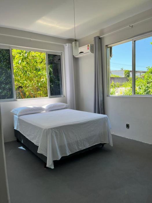 Casa ampla e confortável perto da praia, jardim, tranquilidade e ótima localização