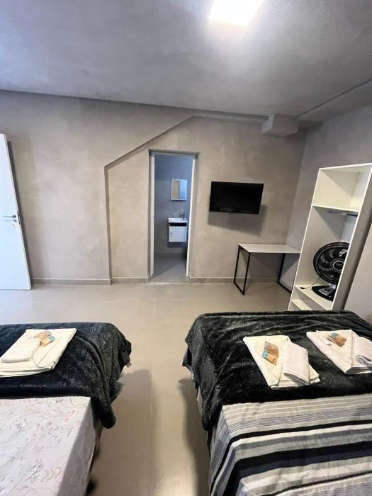 #115 Suíte cama casal e solteiro c vaga - Centro