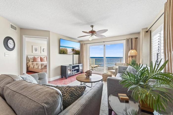 Direct oceanfront corner 22 with stunning views, huge balcony, heated pool, and garage parking