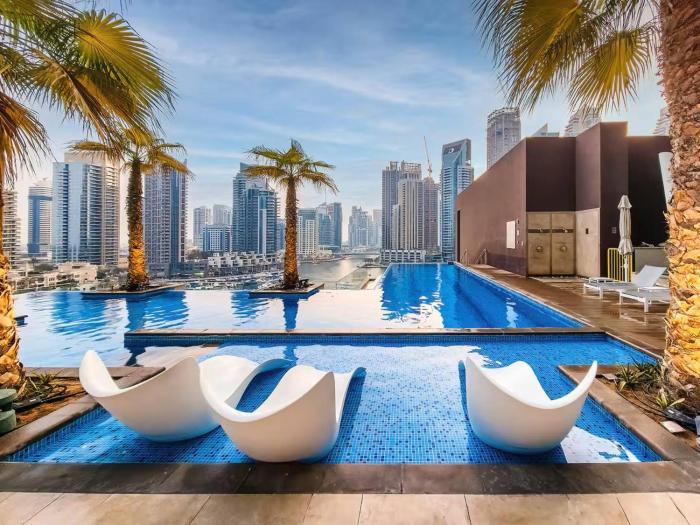 Vogue Vacation Homes, Marina Gate near JBR Beach and Marina Mall, One Bedroom Apartment with Balcony and city skyline view, Access toAmenities