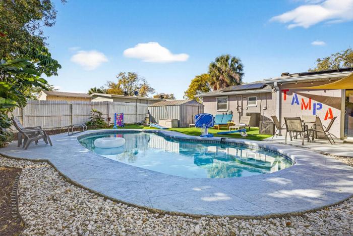 Family Putting Green Oasis BBQ Cornhole Heated Pool