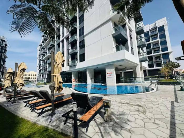 Vogue Vacation Homes, Dubai International City Olivz by Danube near Dragon Mart, One Bedroom Apartment with Balcony and City View, Access toAmenities
