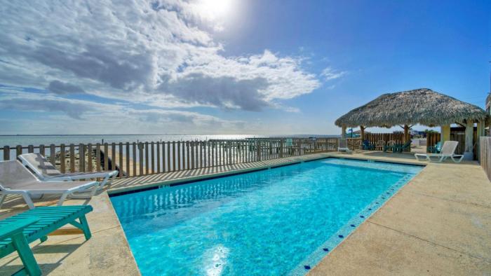 6BDR Balcony w Bay View Shared Pool Boat Dock Keeper Red by AvantStay