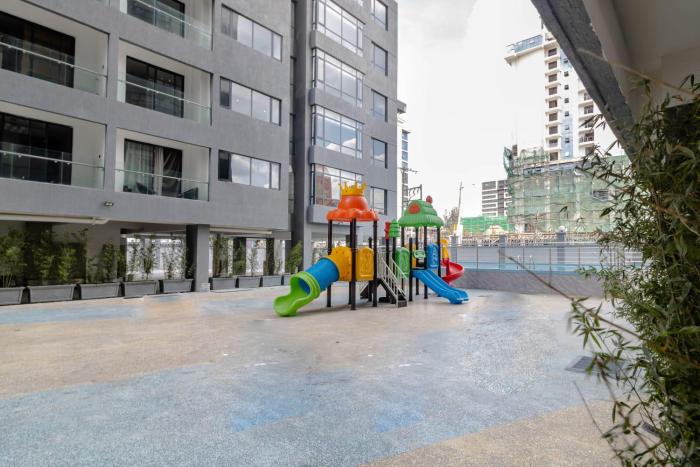 classy executive two bedroom apartment with fully equipped gym ample parking space , swimming pool children playing ground and amazing scenic views