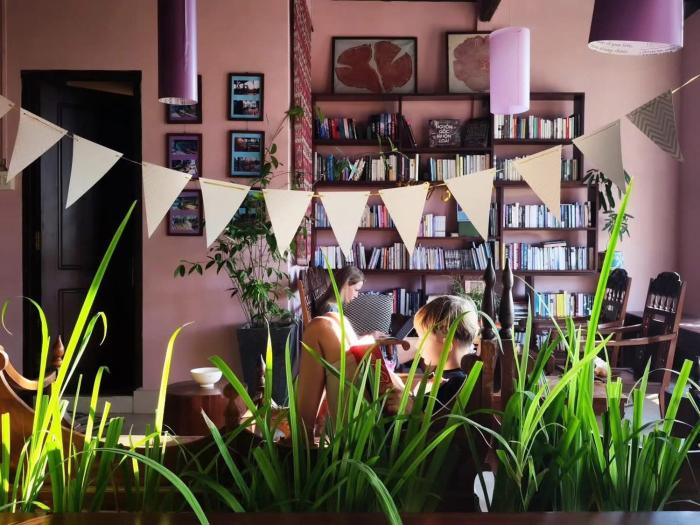 Here Library - A wooden home by the river with a library