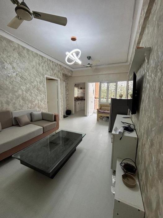 The Golden Mirror A Warm 1BHK with Balcony
