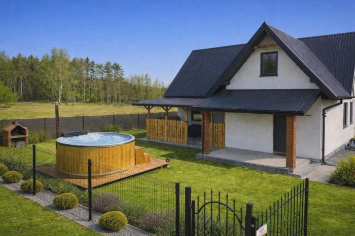 Całoroczny dom wypoczynkowy pod Lasem z prywatnym jaccuzii