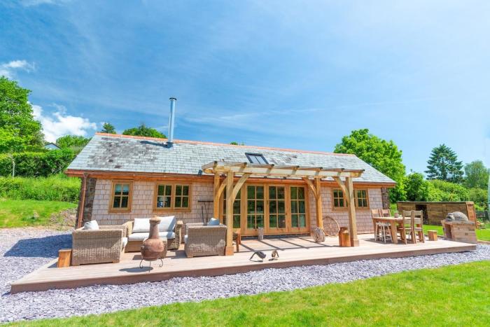 Idyllic countryside cabin with stream and lake