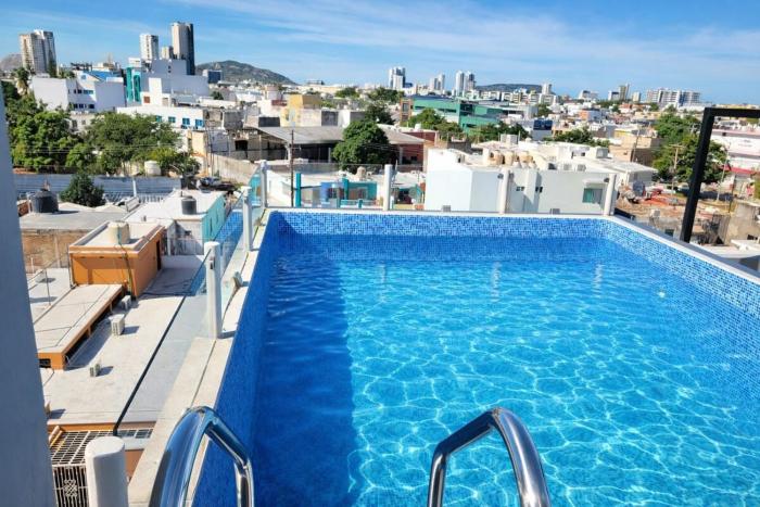 New Two-Bedroom Apartment with a Rooftop Pool, Minutes from the Beach