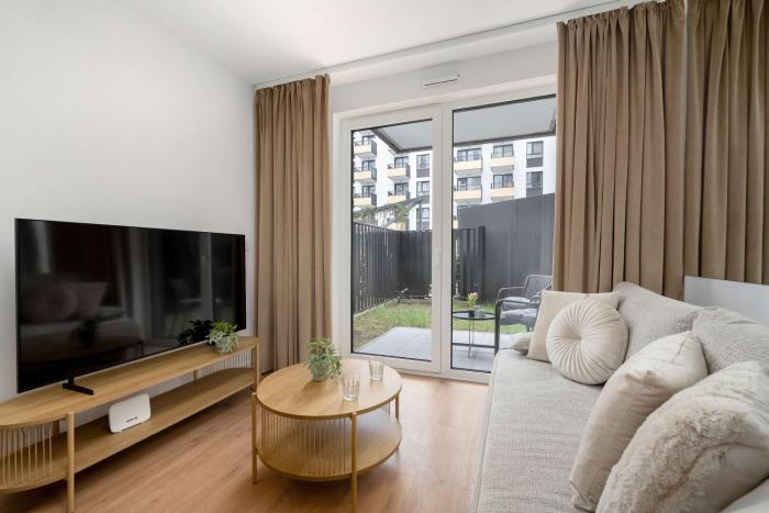 Nowoczesny Apartament z Tarasem i Parkingiem by Noclegi Renters