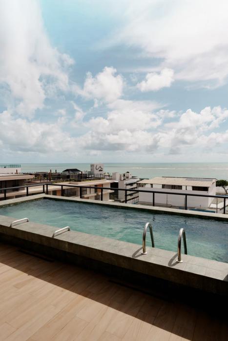 Flat a uma quadra da praia com picina