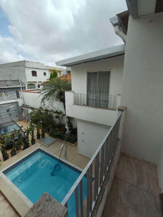 Two-story home with solar-heated pool and 4 bedrooms