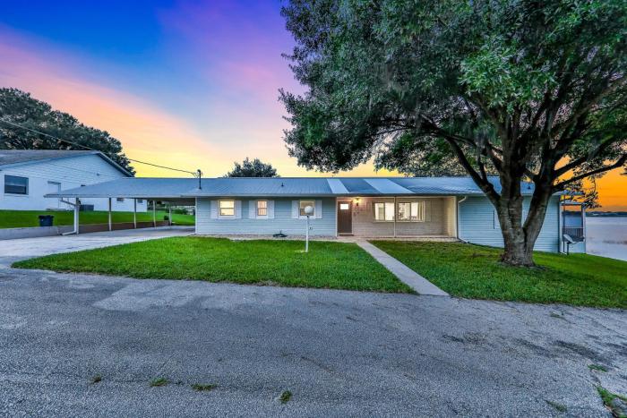 Dog-friendly lakefront home with fast WiFi, central AC, patio, & game room