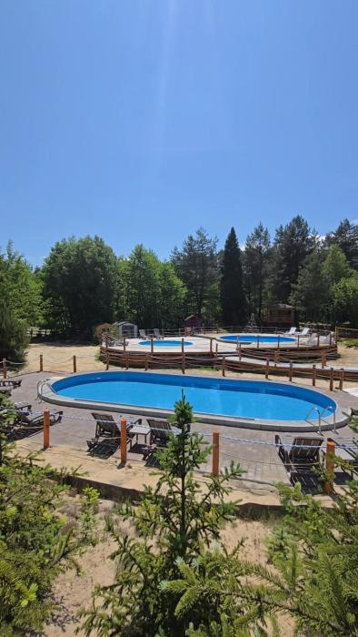 Ośrodek Wypoczynkowy Mamczur Pizuny, Roztocze, PROMOCJA ! Domki z kominkami w sercu lasu, baseny, sauna, jacuzzi w cenie wynajmu