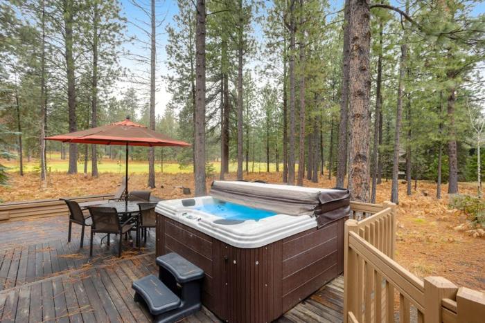 Forested getaway with kitchen stone fireplace pool & private hot tub