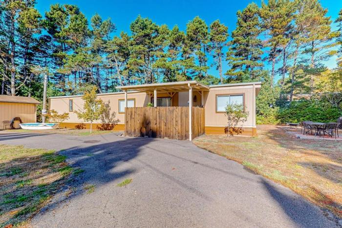 Tree-lined coastal home with childrens items gas grill and washer&dryer