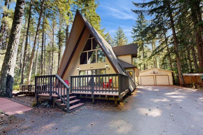 Dog-friendly A-frame cabin with private hot tub - tranquil setting near skiing