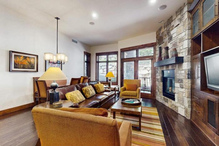 Ski-in-ski-out ground-floor condo with fireplace patio shared pool & hot tub