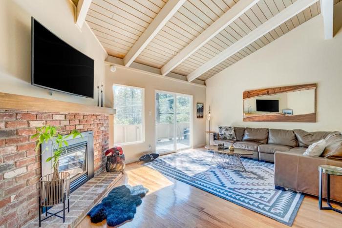Two-story mountain-view condo with balcony fireplace & pool - dog-friendly