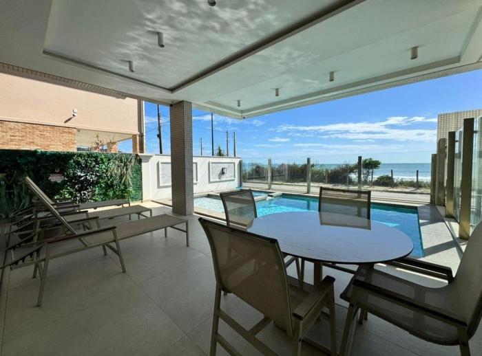 Bellagio Home, apartamento de frente para o mar, com uma vista incrível para a Praia de Palmas