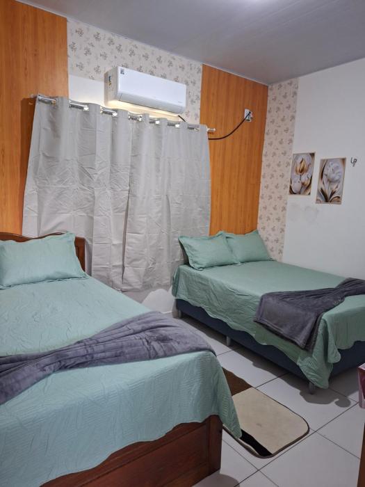 cantinho da Raq,um quarto SUÍTE com ar condicionado duas camas de casal perto doAeroporto, UEPA, Rodoviaria, magueirao, UFPA,parque ambiental,