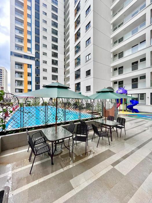 Elegant escape apartment with free parking space,fully equipped gym, swimming pool children playing ground area and amazing city views
