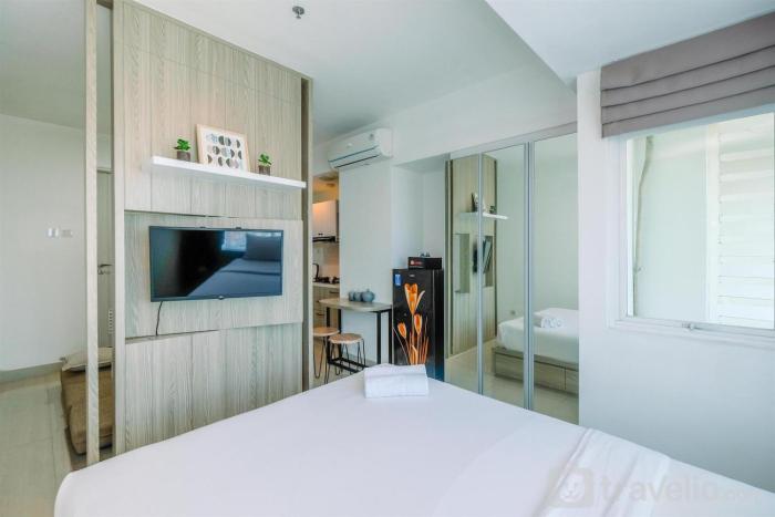 Fully Furnished with Comfy Design Studio Grand Kamala Lagoon Apartment By Travelio