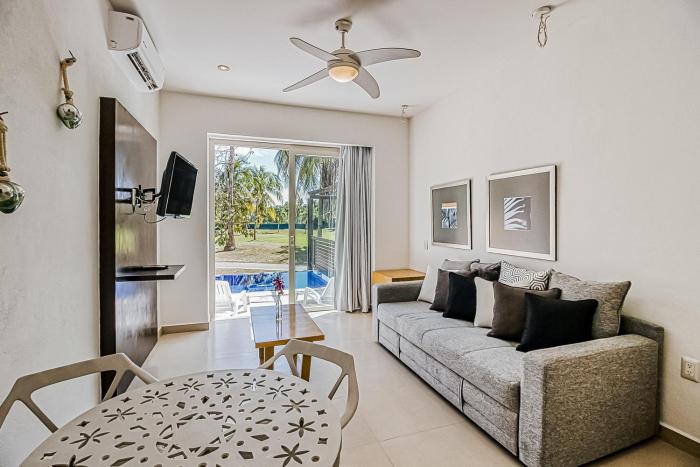 Golf course-adjacent getaway with infinity pool, private plunge pool & balcony