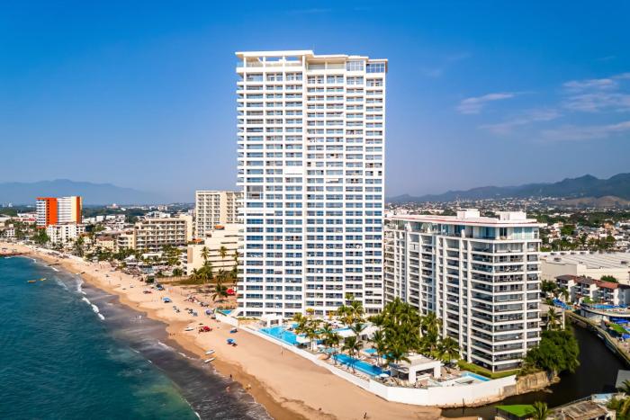 Luxury oceanfront apartment with private balcony, rooftop pool & gym access