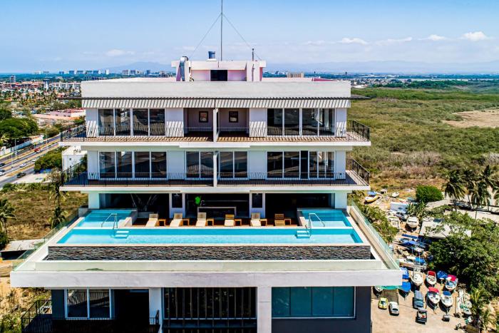 Ocean-view condo in Puerto Vallarta with rooftop pool, fitness room, and balcony
