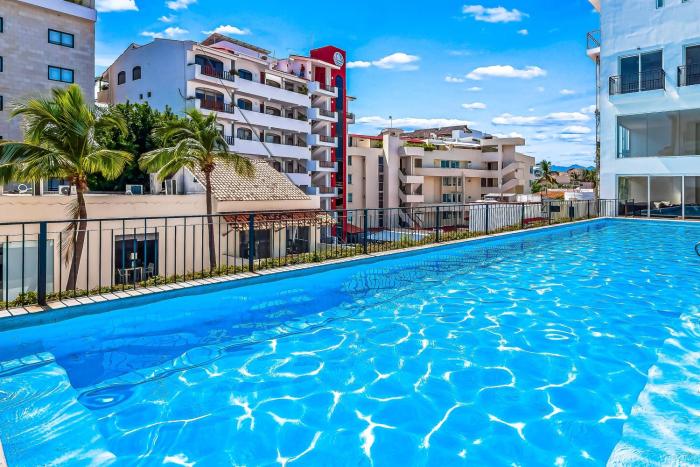 Bright coastal condo with pool access, private balcony & fast Wi-Fi
