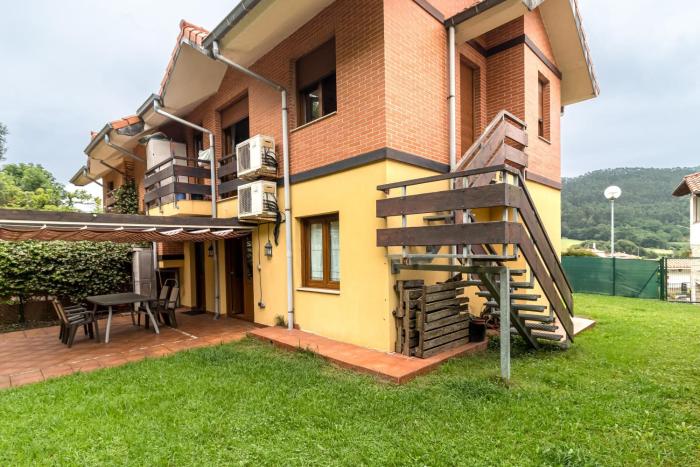 Apartamento con jardín privado