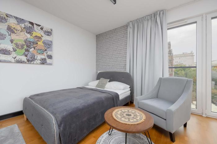 Bright Apartment Okrzei in Warsaw Near PGE by Noclegi Renters