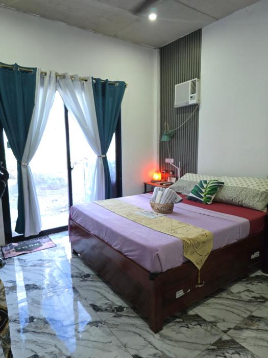 Budget AC Room near Basdako White Beach in moalboal cebu - with own bathroom