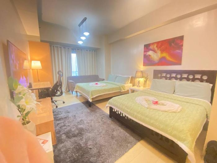 Warm-toned 2 Bed studio Condotel at Newport City Across NAIA Terminal 3
