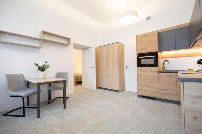 ALURE RESIDENCES 2 - 24h self check-in & private parking next to the apartment building included, CITY CENTER right on SNP Square in a quiet passage, new building, best deal in town