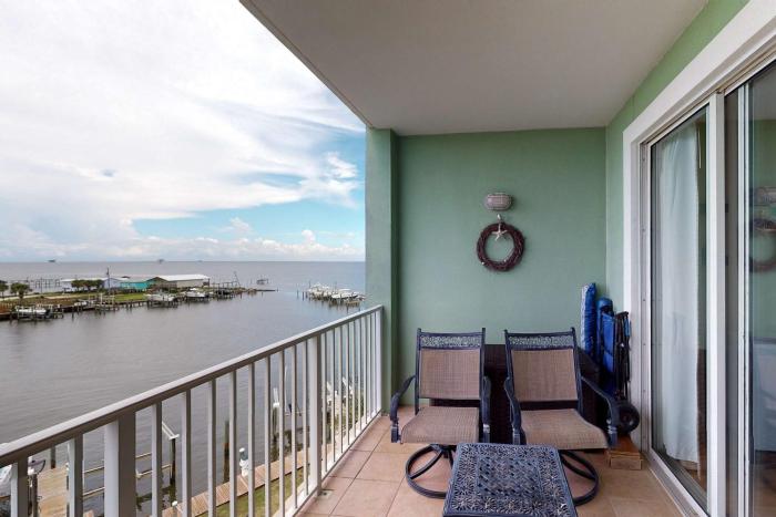 Waterfront condo with bay views pool hot tub boat ramp & private balcony